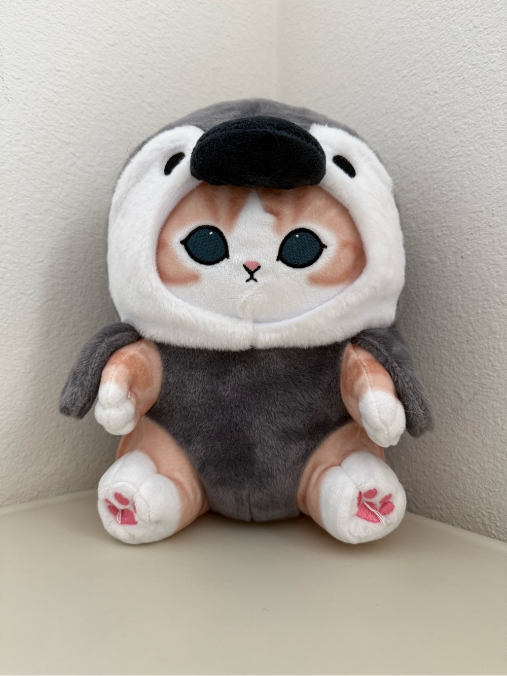 Mofusand dressed in a penguin outfit